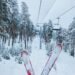red skis on snow covered ground