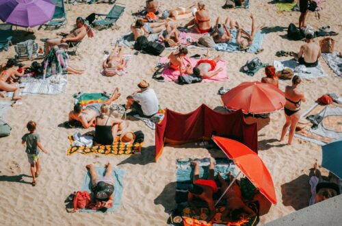 photo of people sunbathing on a beach