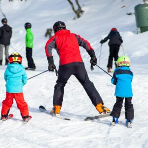 people skiing on snow covered ground