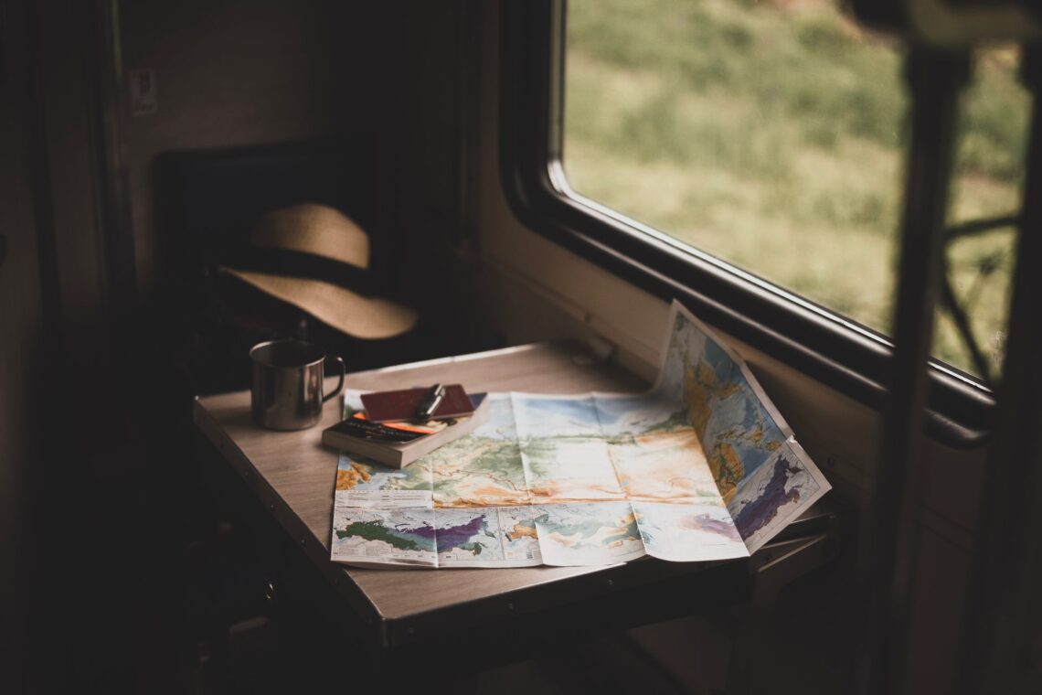 map and book on the table near the window